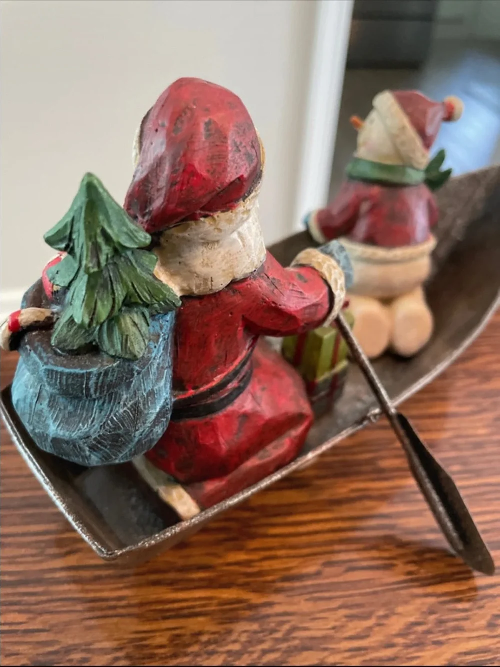 Santa and Snowman in metal fishing boat